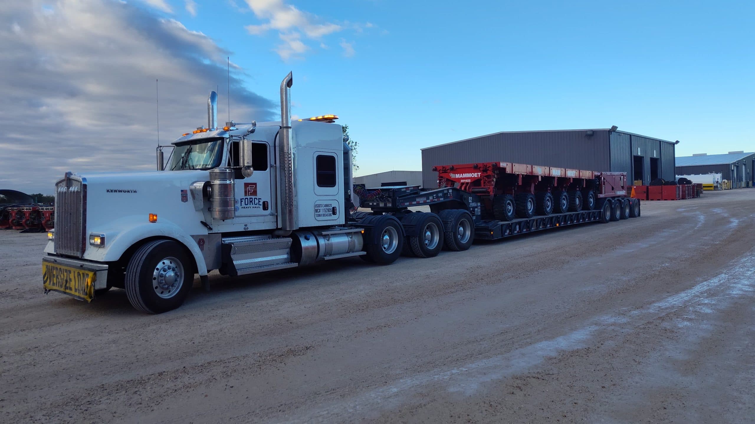 Force 2026 Kenworth W900 sleeper tractor with a multi-axle heavy haul trailer